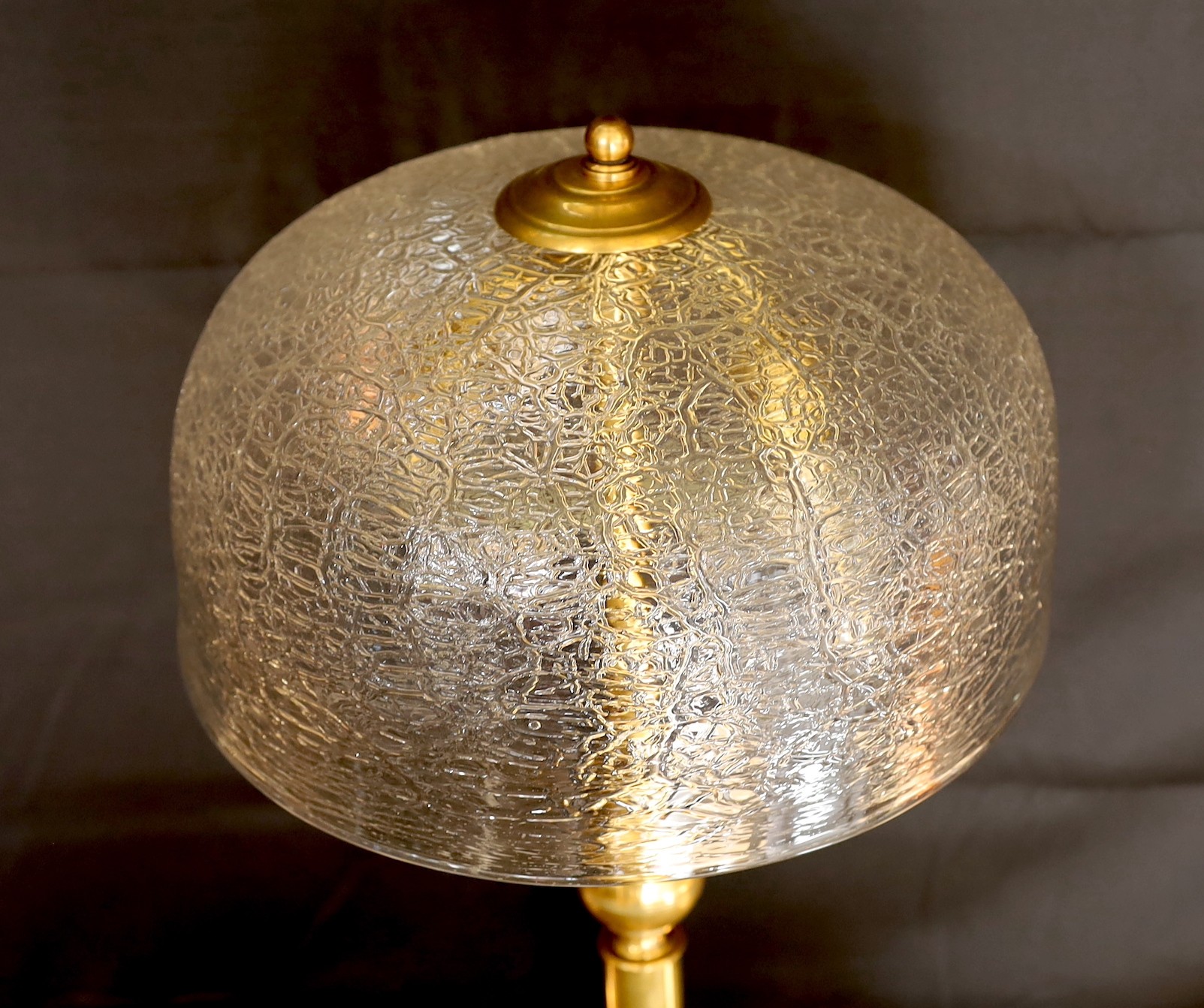 A 1960s German brass table lamp with crackle effect glass shade, height 57cm